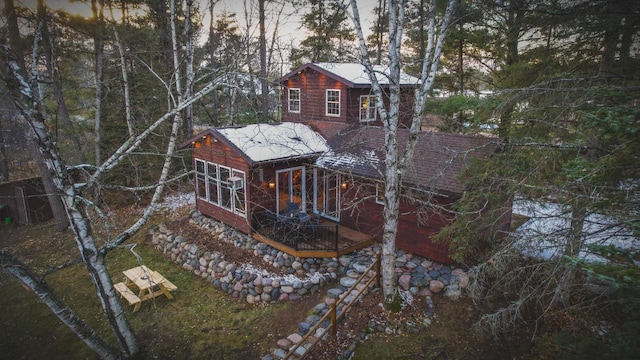 back of house featuring a wooden deck