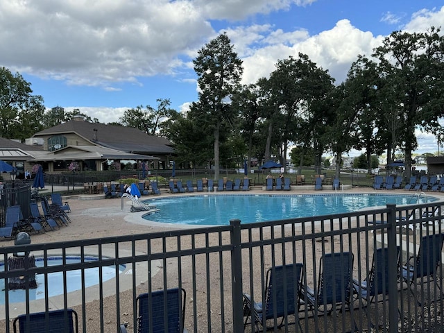 view of swimming pool with a patio