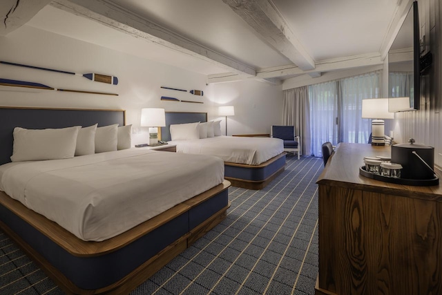 carpeted bedroom featuring beamed ceiling