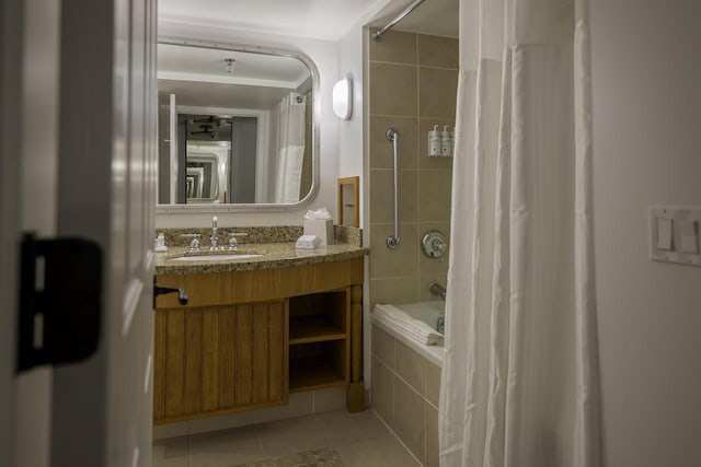 bathroom featuring tile patterned flooring, vanity, and shower / bath combination with curtain