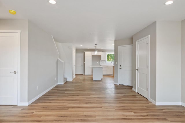 unfurnished living room featuring light hardwood / wood-style floors