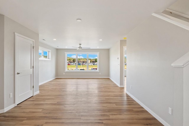 interior space featuring recessed lighting, baseboards, light wood-style floors, and a ceiling fan