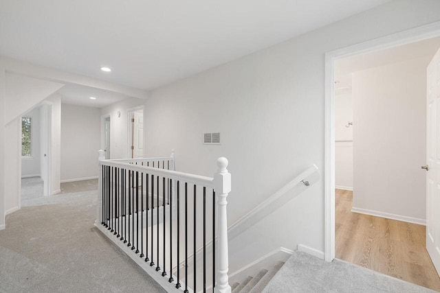 corridor featuring light hardwood / wood-style floors