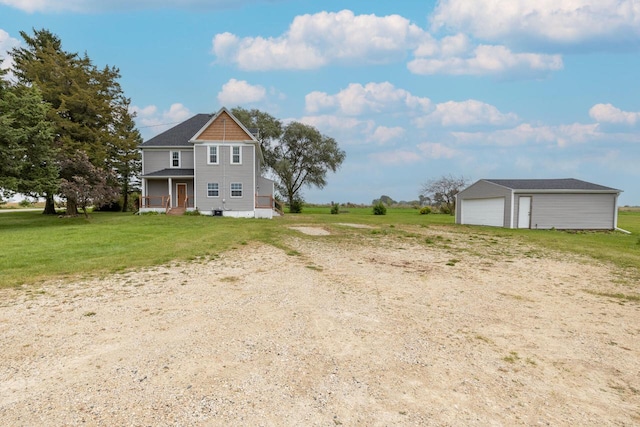 exterior space with an outdoor structure, a garage, and a porch