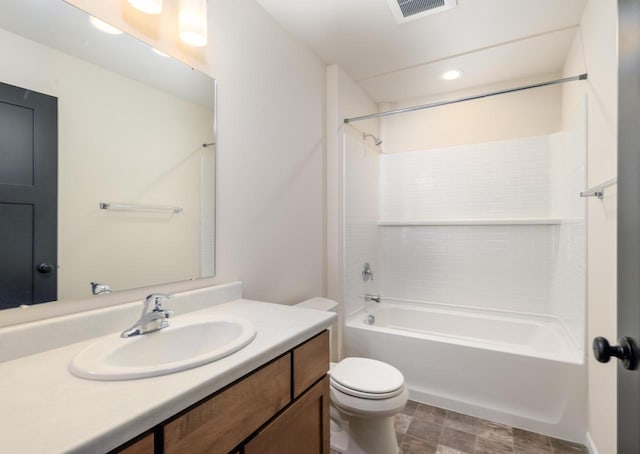 full bathroom with shower / bath combination, vanity, and toilet