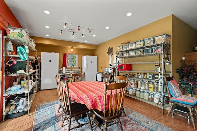 dining room with light wood-type flooring