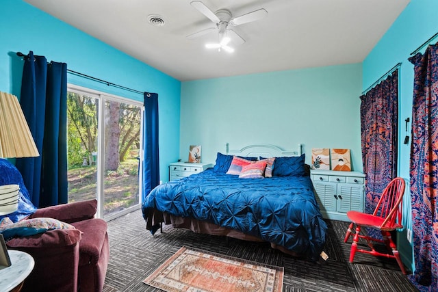 carpeted bedroom featuring ceiling fan and access to outside