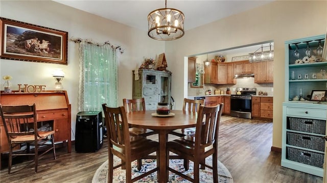 dining room featuring a chandelier and dark hardwood / wood-style floors