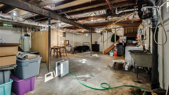 basement featuring water heater and sink