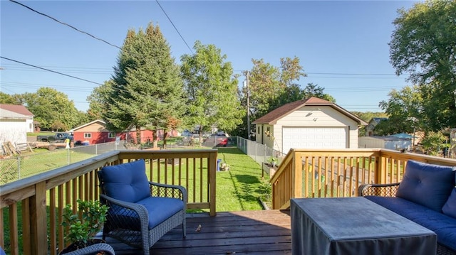 wooden deck with a garage, an outbuilding, and a yard