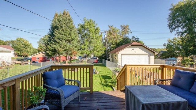 807 Miner Ave, Ladysmith, WI 54848 - wooden deck with a lawn, an outdoor structure, a detached garage, and fence
