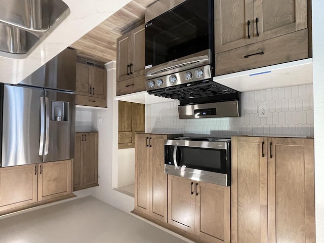 kitchen featuring concrete flooring and backsplash