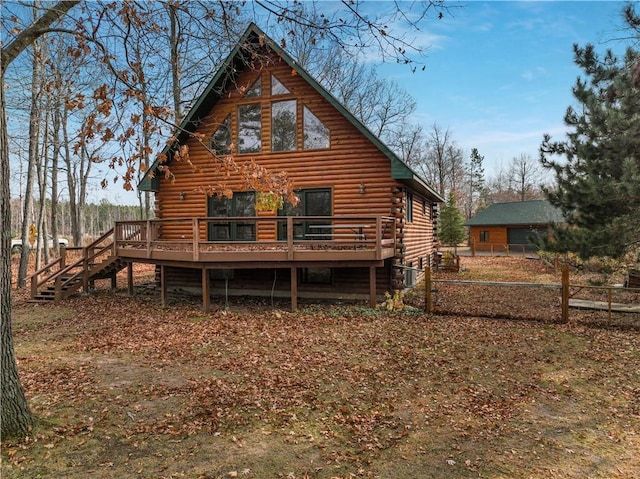 14665 W Buckeye Ln, Stone Lake, WI 54876 - rear view of property with log siding, a wooden deck, and stairway