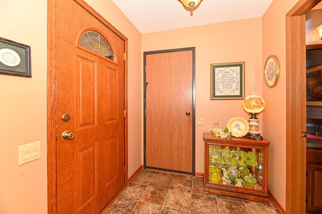 foyer entrance featuring a textured ceiling