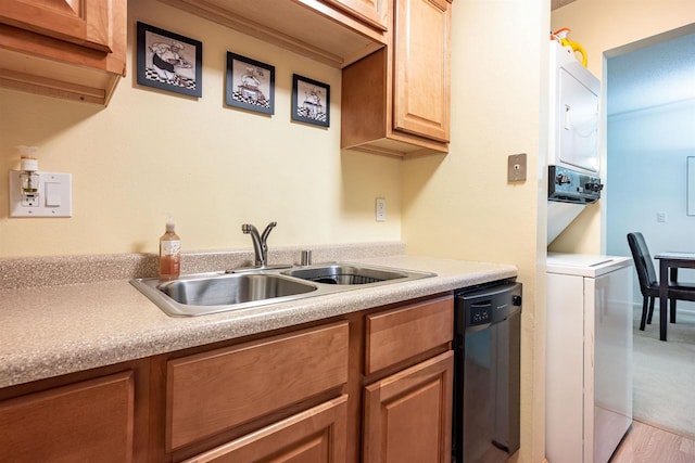 kitchen featuring dishwasher, light hardwood / wood-style floors, and sink