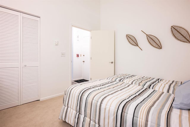 carpeted bedroom featuring a closet