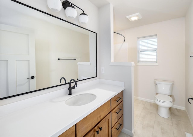 bathroom featuring toilet, tile patterned floors, and vanity