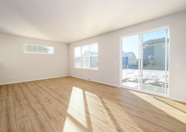 unfurnished room featuring light hardwood / wood-style floors