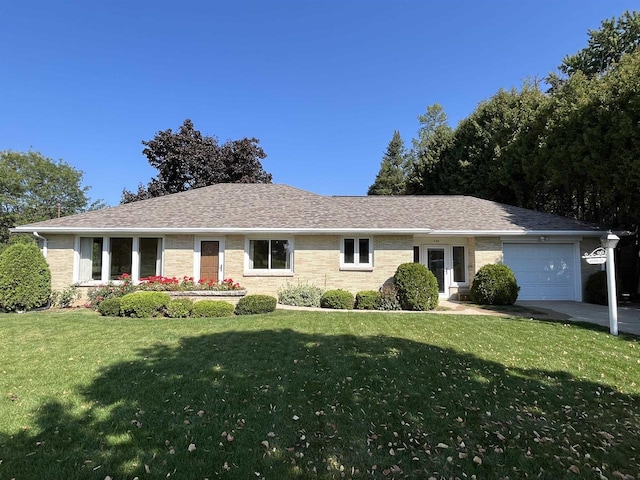 ranch-style home with a front yard and a garage