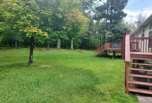 view of yard featuring a wooden deck