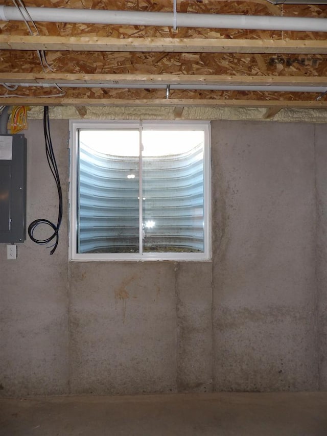 room details featuring concrete flooring and electric panel