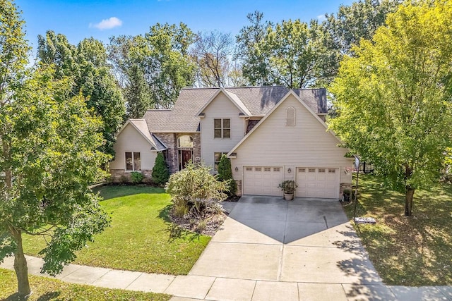 view of front of property with a front yard and a garage