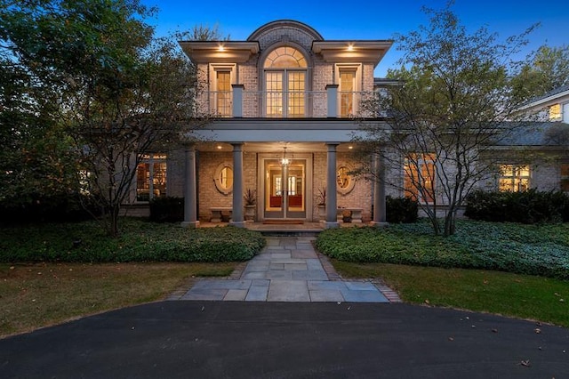 view of front facade with french doors and covered porch