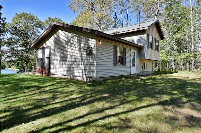 view of home's exterior featuring a lawn