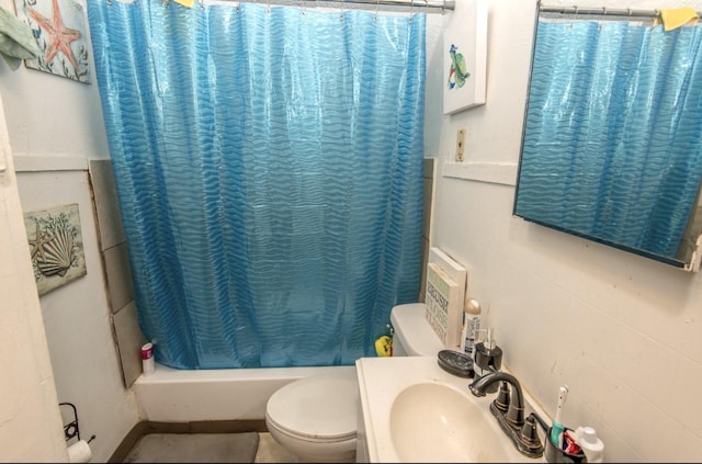 full bathroom with vanity, shower / tub combo, and toilet