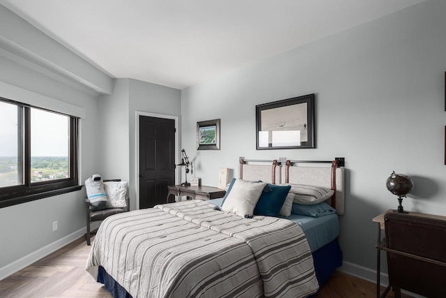 bedroom featuring light parquet flooring