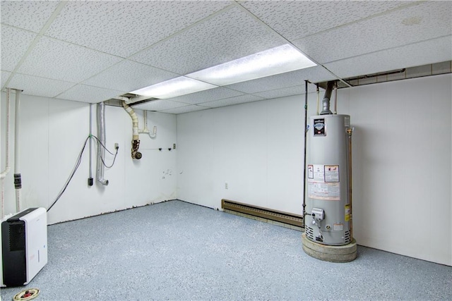 basement with water heater and a drop ceiling