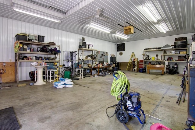 garage featuring a garage door opener and a workshop area