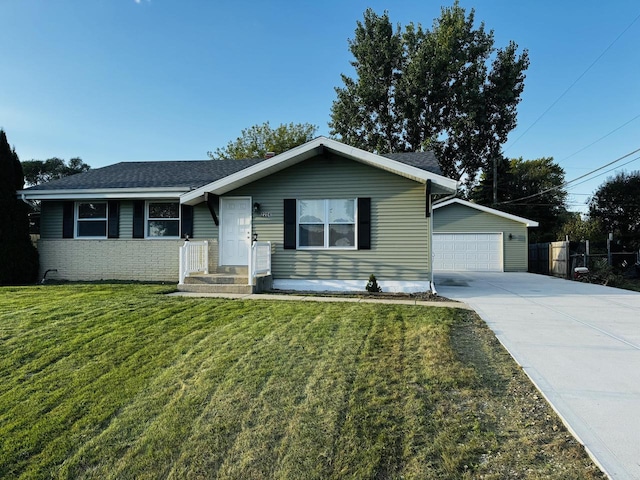 ranch-style house featuring a front lawn and a garage