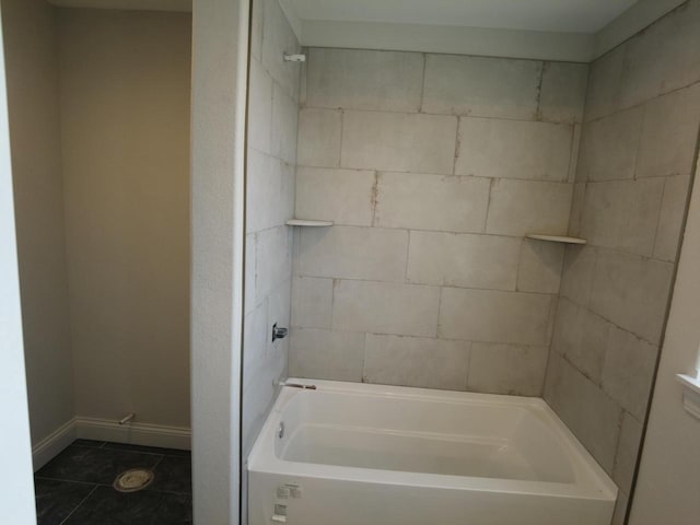 full bathroom with tile patterned flooring, baseboards, and shower / tub combination