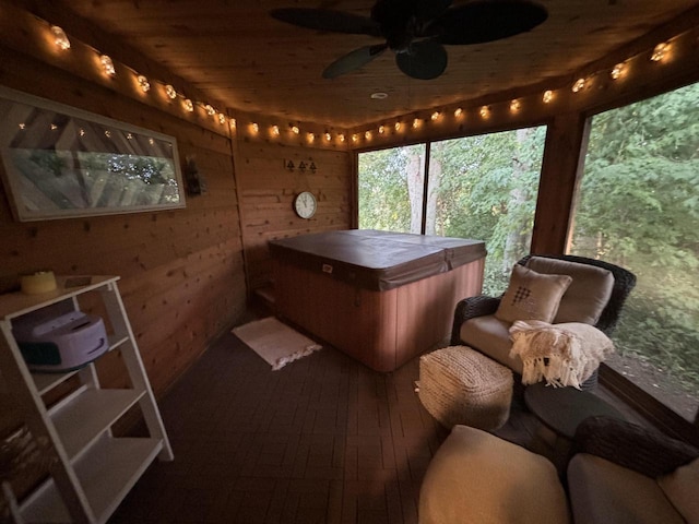 sunroom / solarium with a jacuzzi, wooden ceiling, and ceiling fan