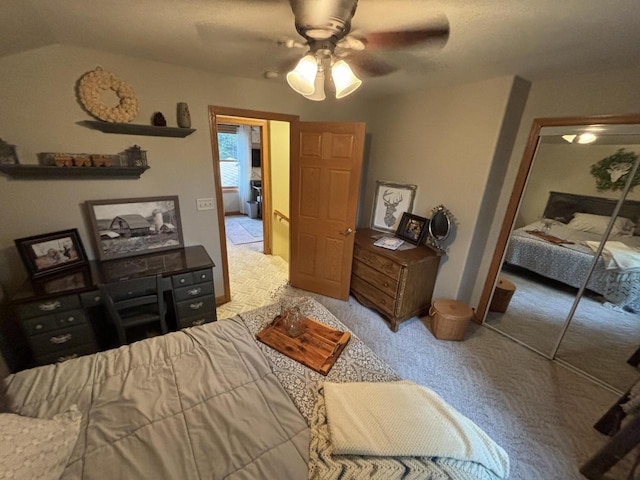 carpeted bedroom with a closet and ceiling fan