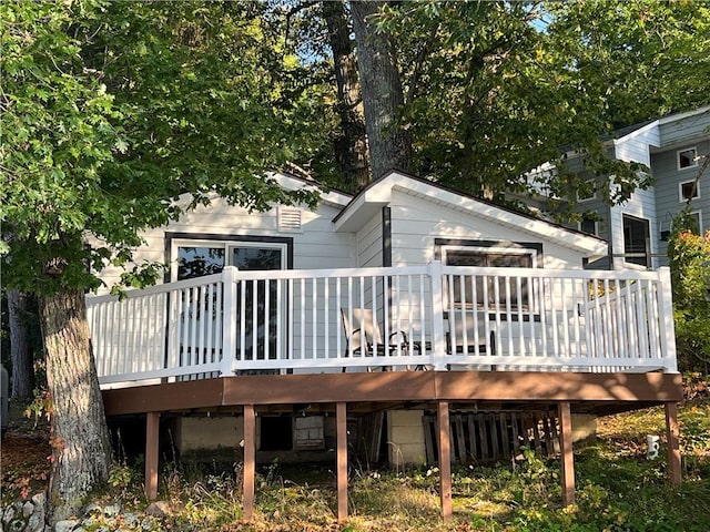 back of property with a wooden deck