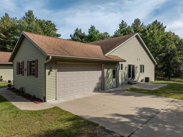 ranch-style home featuring a front yard and a garage