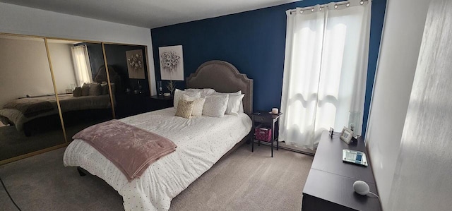 bedroom featuring carpet and a closet