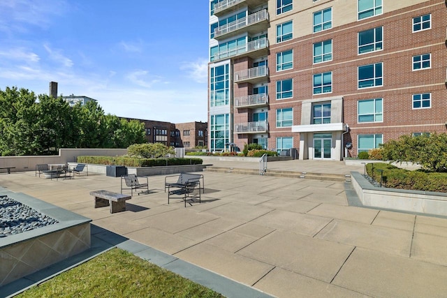 view of home's community with a patio area