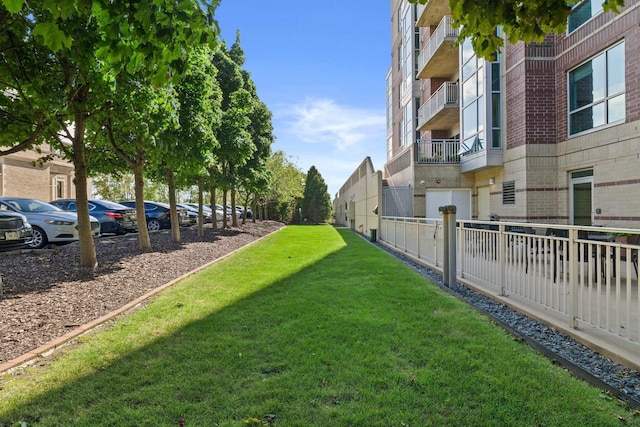 view of yard featuring a balcony