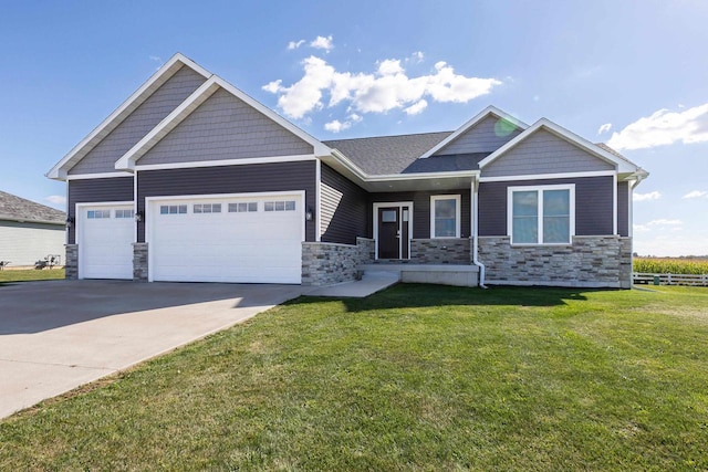 craftsman-style house with a front lawn and a garage