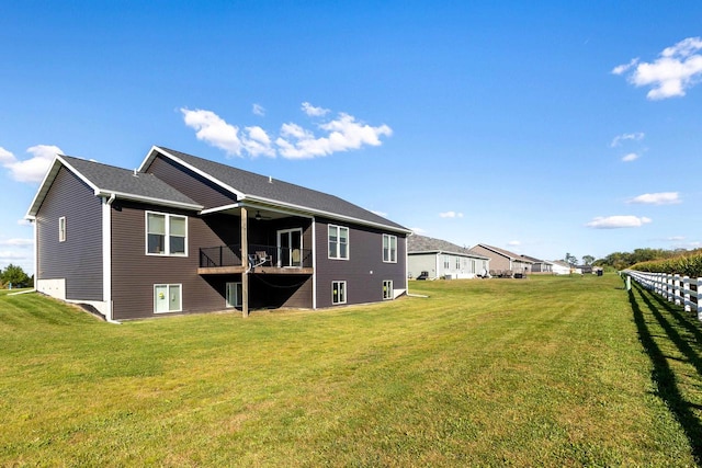 rear view of house with a yard