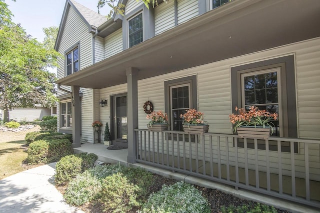 property entrance with covered porch