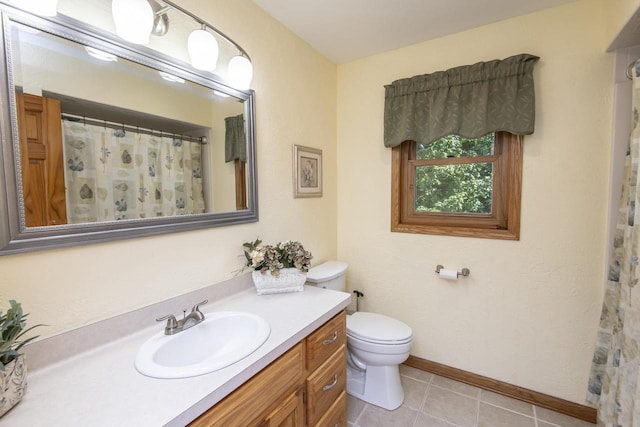 bathroom with toilet, tile patterned flooring, a shower with curtain, and vanity