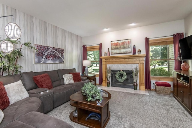 carpeted living room with a fireplace