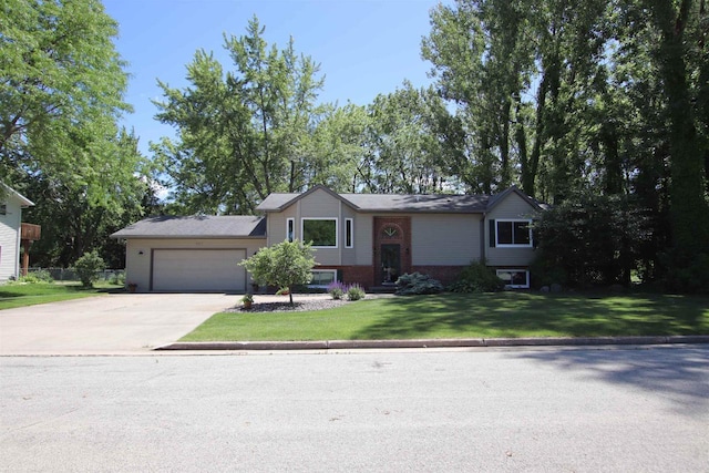 view of front facade with a garage and a front lawn