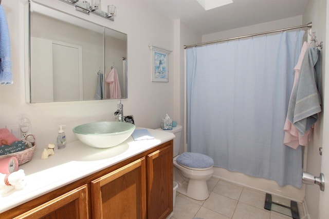 full bathroom featuring vanity, shower / tub combo, toilet, and tile patterned flooring