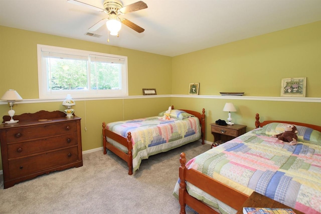 bedroom featuring ceiling fan and light colored carpet