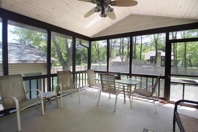 sunroom featuring ceiling fan and a wealth of natural light